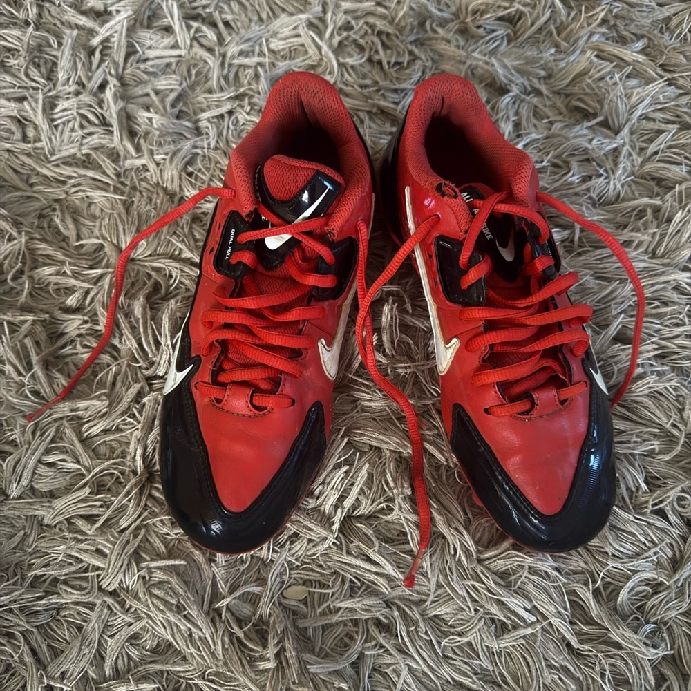 Red and Black Athletic Shoes cleats Nike
